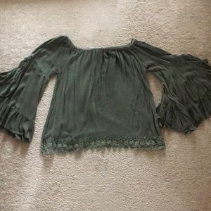 Woman’s off the shoulder top.